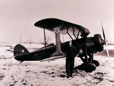 Art Davis poses with a taper-wing Waco CTO. Photo courtesy of Capital Area District Libraries.